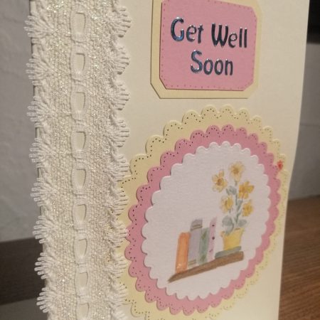 "Get Well Soon" handmade card with decorative ribbon and a watercolour centre