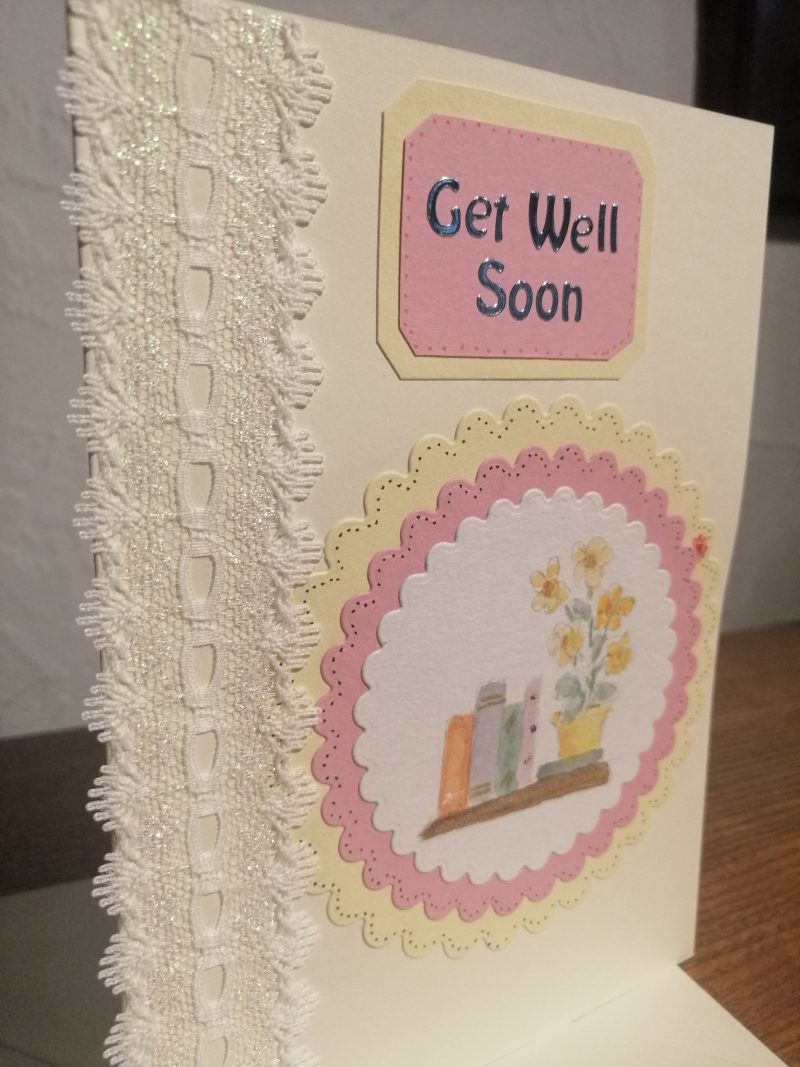 "Get Well Soon" handmade card with decorative ribbon and a watercolour centre