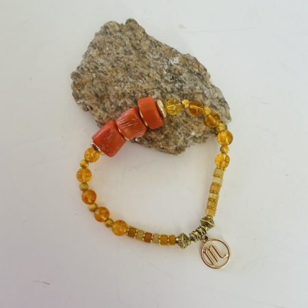 Scorpio / November birthday charm bracelet featuring citrine, topaz and deep sea coral