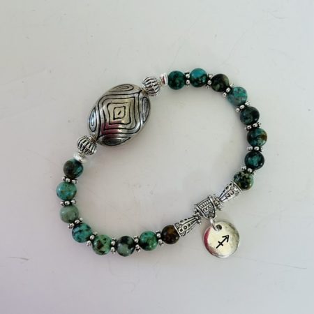 Sagittarius / December birthday charm bracelet featuring turquoise beads