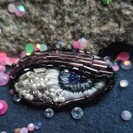 Shiny eye brooch