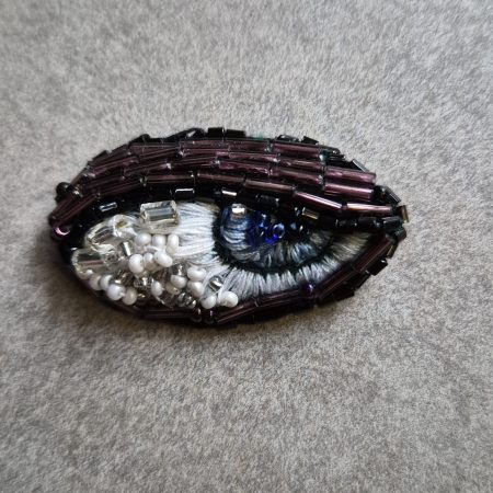 Shiny eye brooch