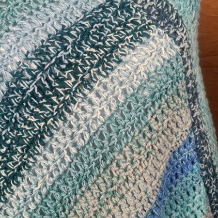 Blue crochet poncho