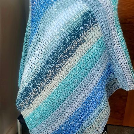Blue crochet poncho