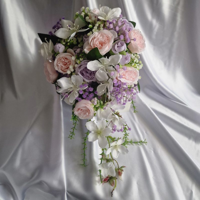 Wedding flower arrangements. All you need. Bride's bouquet, Groom's boutonniere, 4 Bridesmaid'sbouquets, 4 Groomsman boutonnieres, Flower basket & headpiece for Flower girl, "Something blue'. All handmade from artificial silk flowers.