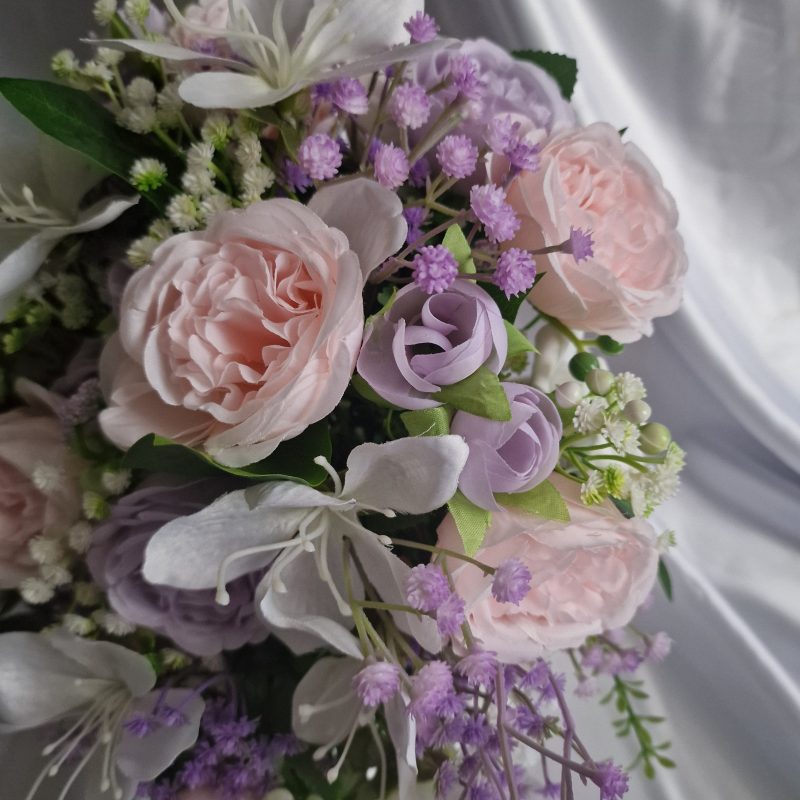 Wedding flower arrangements. All you need. Bride's bouquet, Groom's boutonniere, 4 Bridesmaid'sbouquets, 4 Groomsman boutonnieres, Flower basket & headpiece for Flower girl, "Something blue'. All handmade from artificial silk flowers.