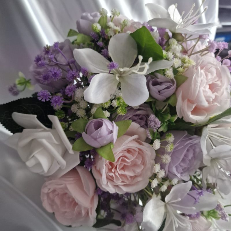 Wedding flower arrangements. All you need. Bride's bouquet, Groom's boutonniere, 4 Bridesmaid'sbouquets, 4 Groomsman boutonnieres, Flower basket & headpiece for Flower girl, "Something blue'. All handmade from artificial silk flowers.