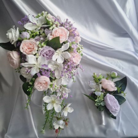 Wedding flower arrangements. All you need. Bride's bouquet, Groom's boutonniere, 4 Bridesmaid'sbouquets, 4 Groomsman boutonnieres, Flower basket & headpiece for Flower girl, "Something blue'. All handmade from artificial silk flowers.