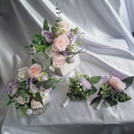 Wedding flower arrangements. All you need. Bride's bouquet, Groom's boutonniere, 4 Bridesmaid'sbouquets, 4 Groomsman boutonnieres, Flower basket & headpiece for Flower girl, "Something blue'. All handmade from artificial silk flowers.