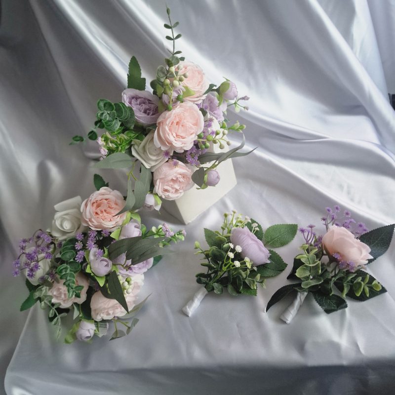 Wedding flower arrangements. All you need. Bride's bouquet, Groom's boutonniere, 4 Bridesmaid'sbouquets, 4 Groomsman boutonnieres, Flower basket & headpiece for Flower girl, "Something blue'. All handmade from artificial silk flowers.