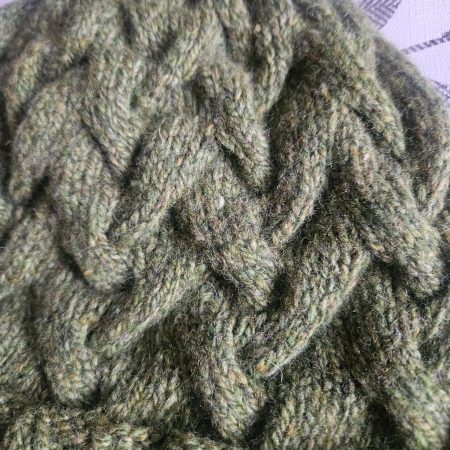 Handknitted 100% wool cabled hat.