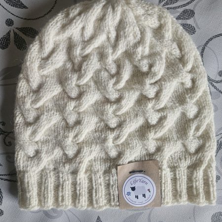 Handknitted 100% wool cabled hat.