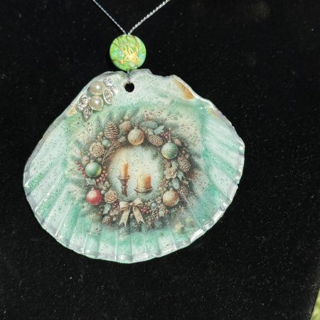 Shell-shaped Christmas ornament with decoupage and resin