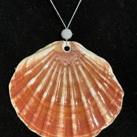 Shell-shaped Christmas ornament with resin decoupage