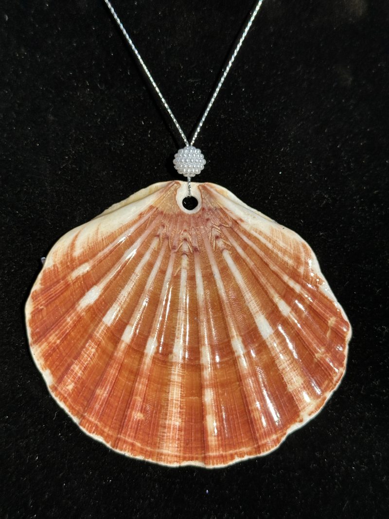 Shell-shaped Christmas ornament with resin decoupage
