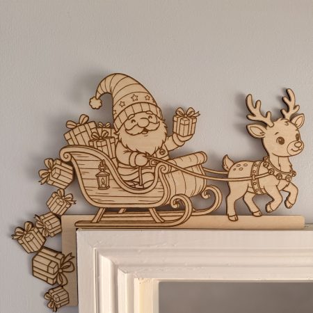 Plain wooden Santa sleigh and reindeer decoration sitting above the left corner of a door frame, with presents extending down the side.
