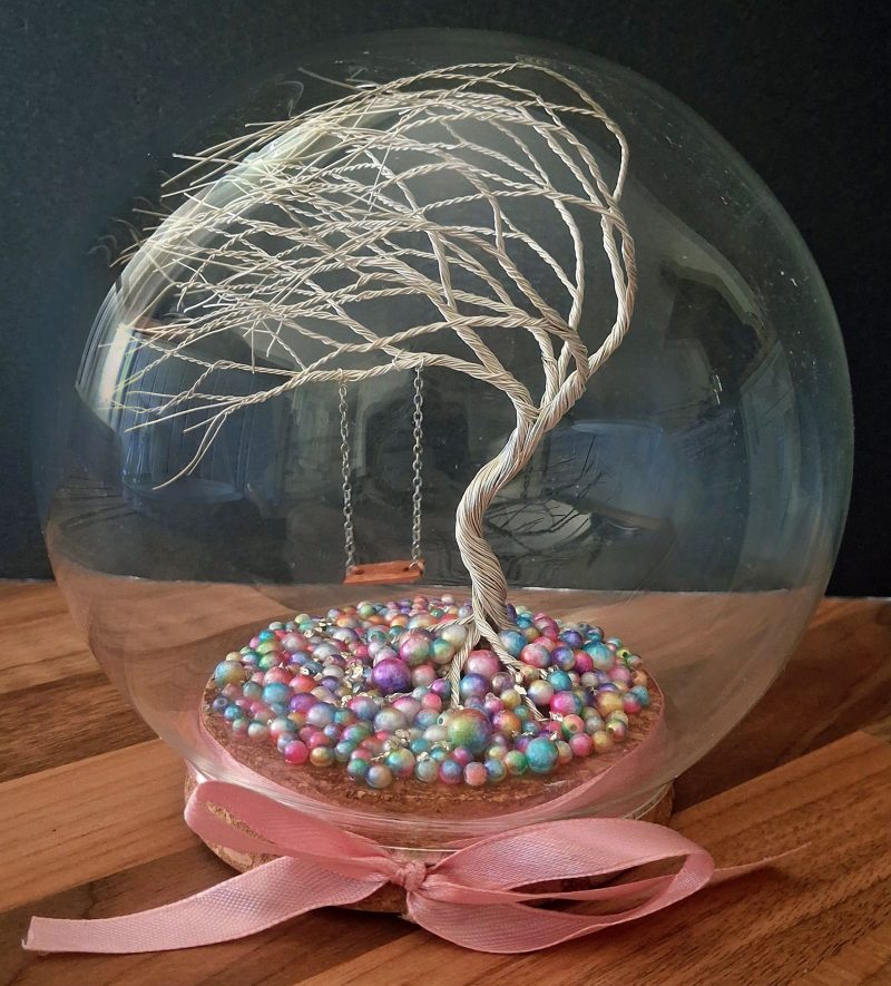 Whimsical enchanted tree dome with moving swing