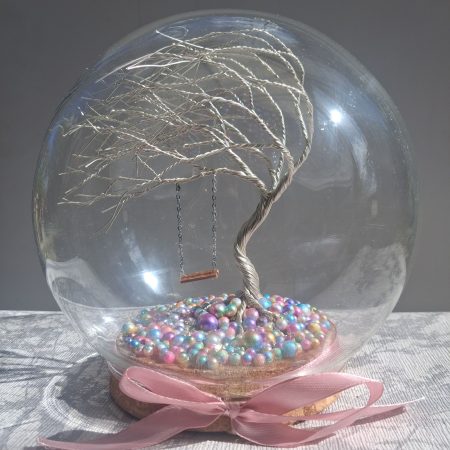 Whimsical enchanted tree dome with moving swing