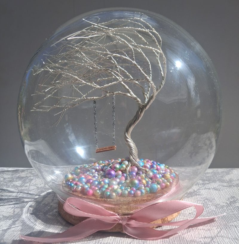 Whimsical enchanted tree dome with moving swing