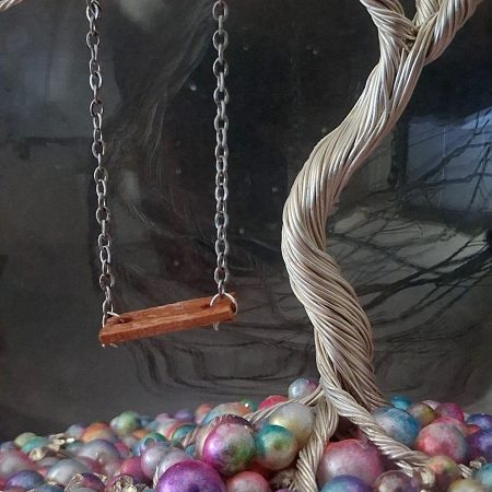Whimsical enchanted tree dome with moving swing