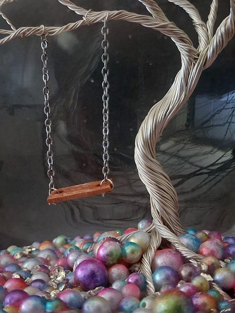 Whimsical enchanted tree dome with moving swing