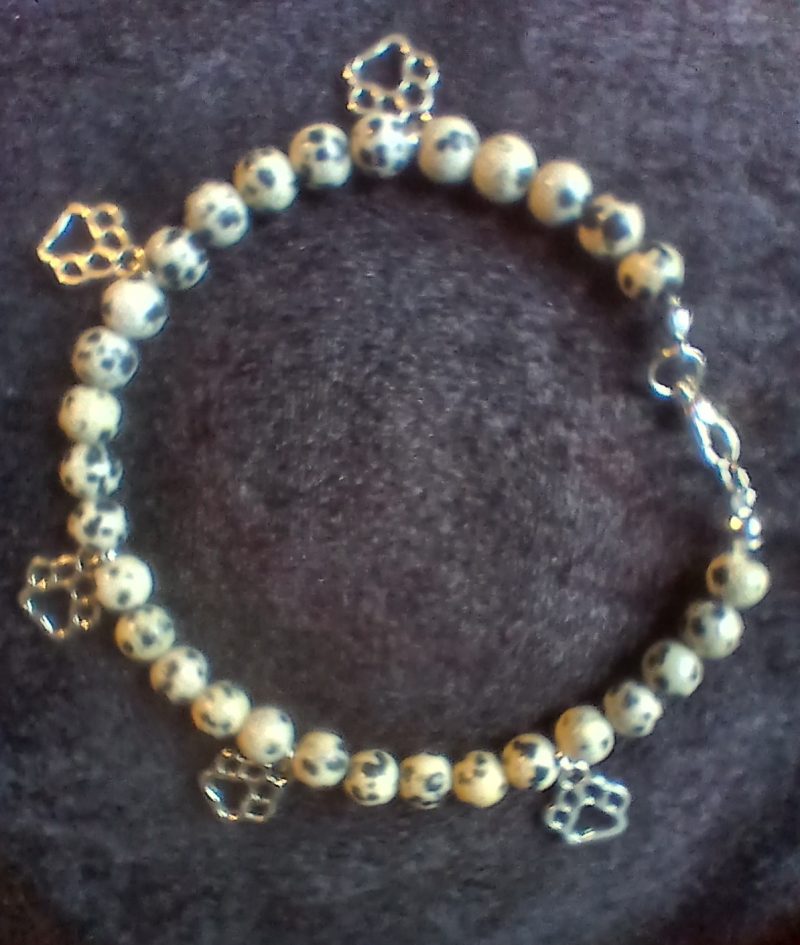 Hand-made bracelet made from natural gemstones with charms.
