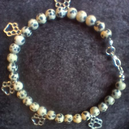 Hand-made bracelet made from natural gemstones with charms.