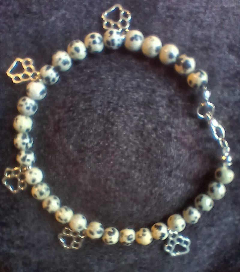 Hand-made bracelet made from natural gemstones with charms.