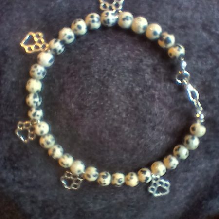 Hand-made bracelet made from natural gemstones with charms.