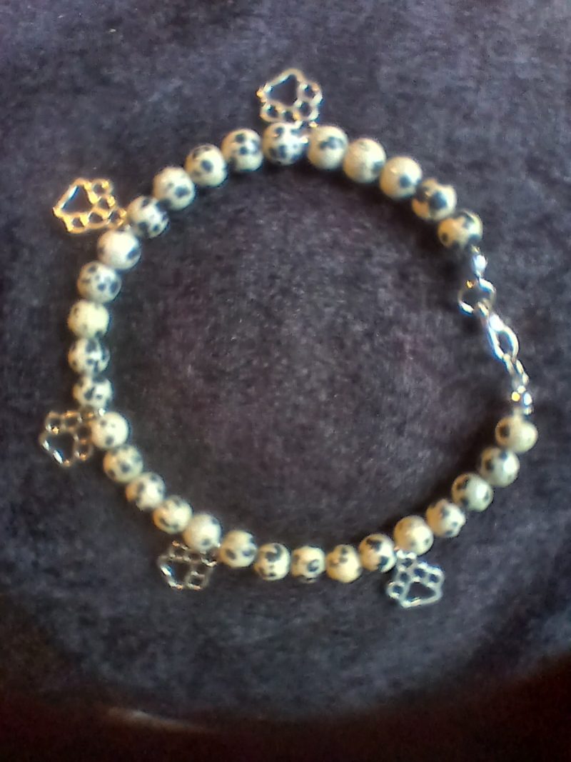 Hand-made bracelet made from natural gemstones with charms.