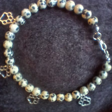 Hand-made bracelet made from natural gemstones with charms.