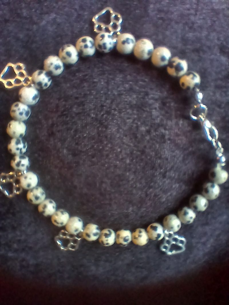 Hand-made bracelet made from natural gemstones with charms.