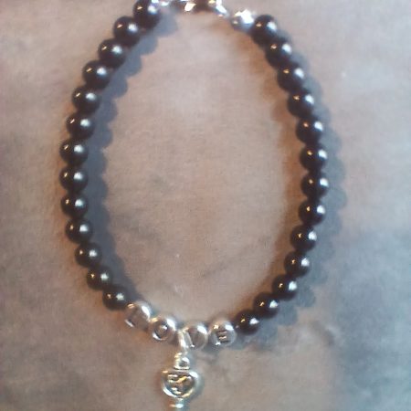 Hand-made bracelet made from natural gemstones with charms.