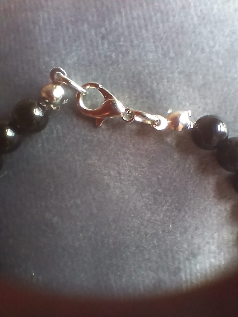 Hand-made bracelet made from natural gemstones with charms.