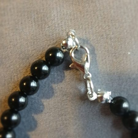 Hand-made bracelet made from natural gemstones with charms.