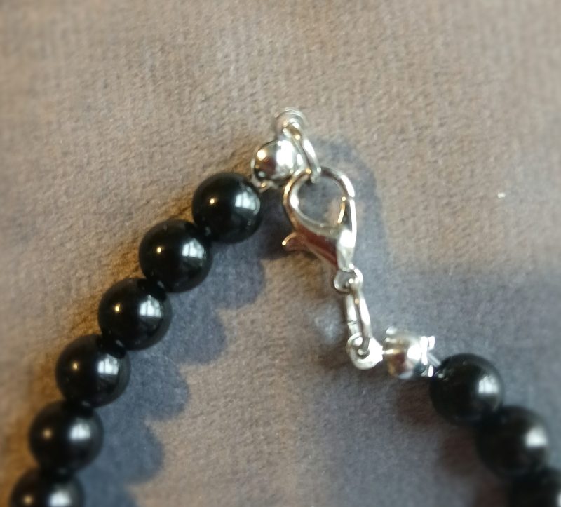 Hand-made bracelet made from natural gemstones with charms.