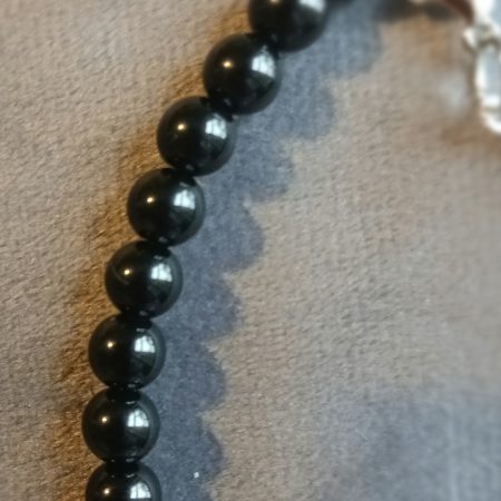 Hand-made bracelet made from natural gemstones with charms.