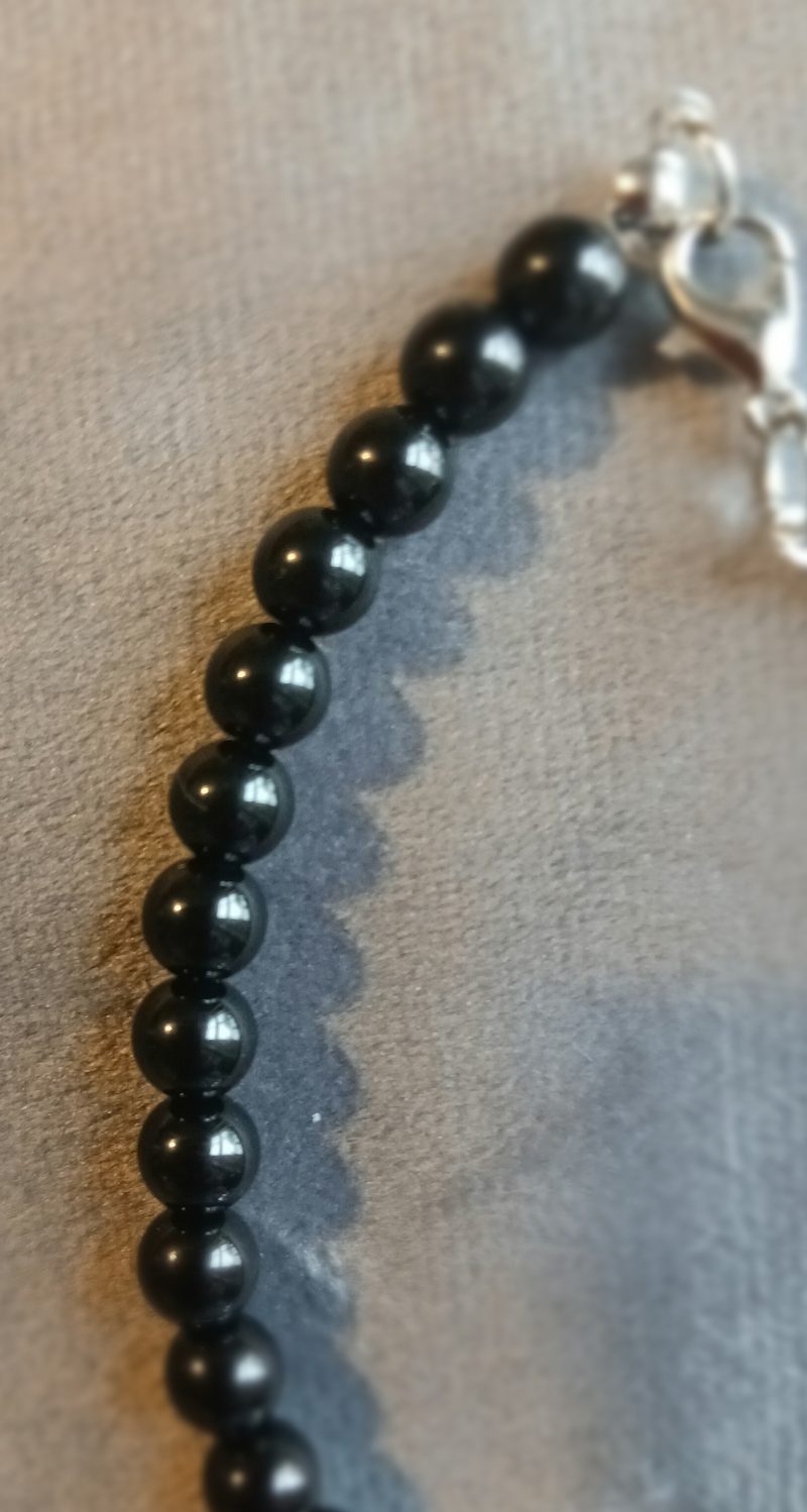 Hand-made bracelet made from natural gemstones with charms.