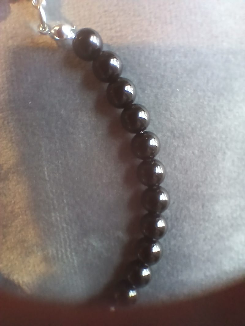 Hand-made bracelet made from natural gemstones with charms.