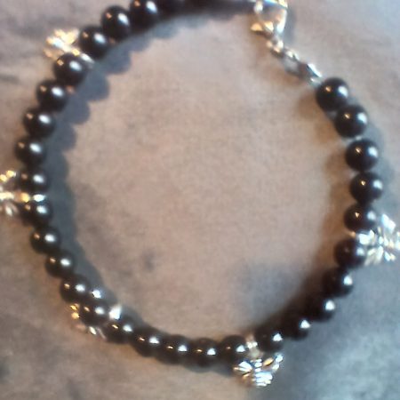 Hand-made bracelet made from natural gemstones with charms.
