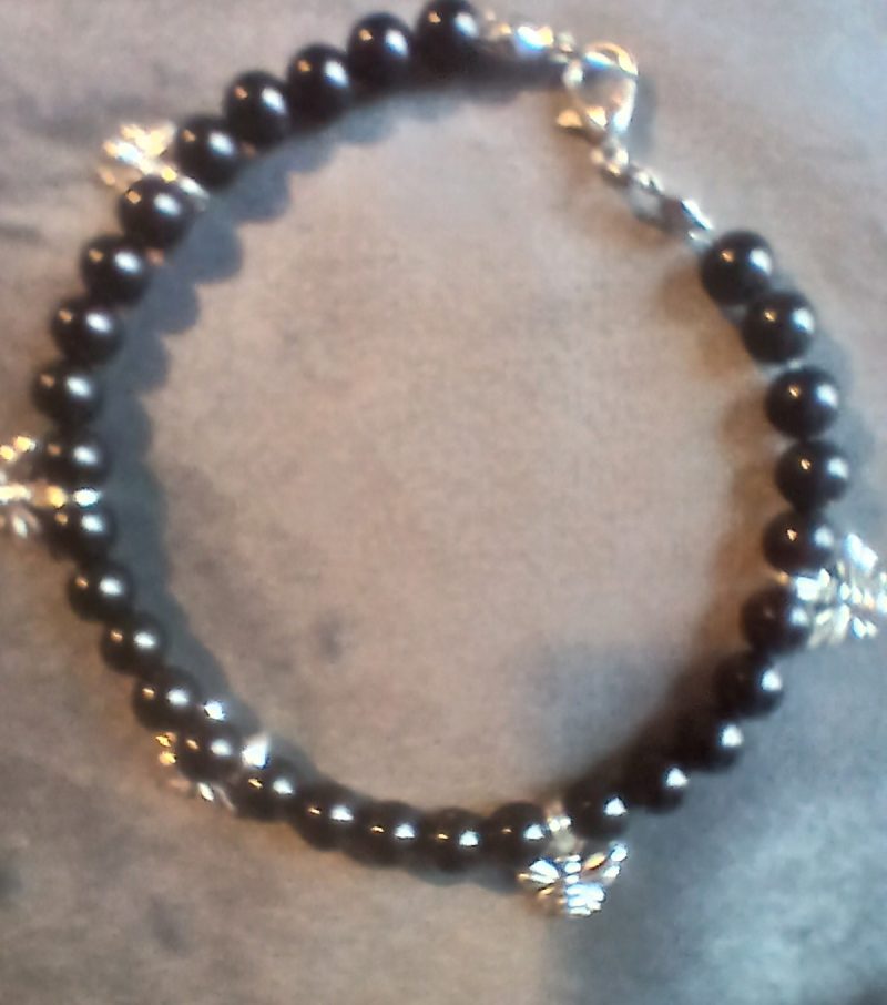 Hand-made bracelet made from natural gemstones with charms.