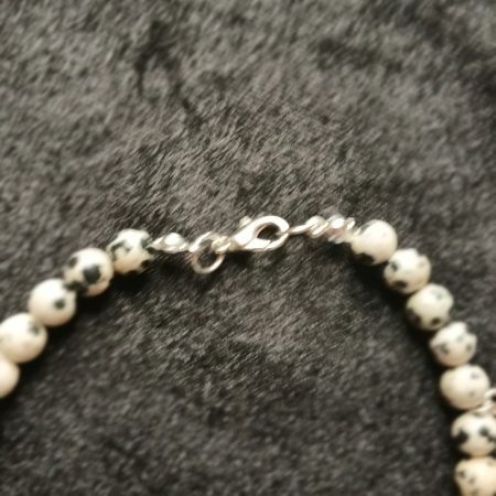 Hand-made bracelet made from natural gemstones with charms.