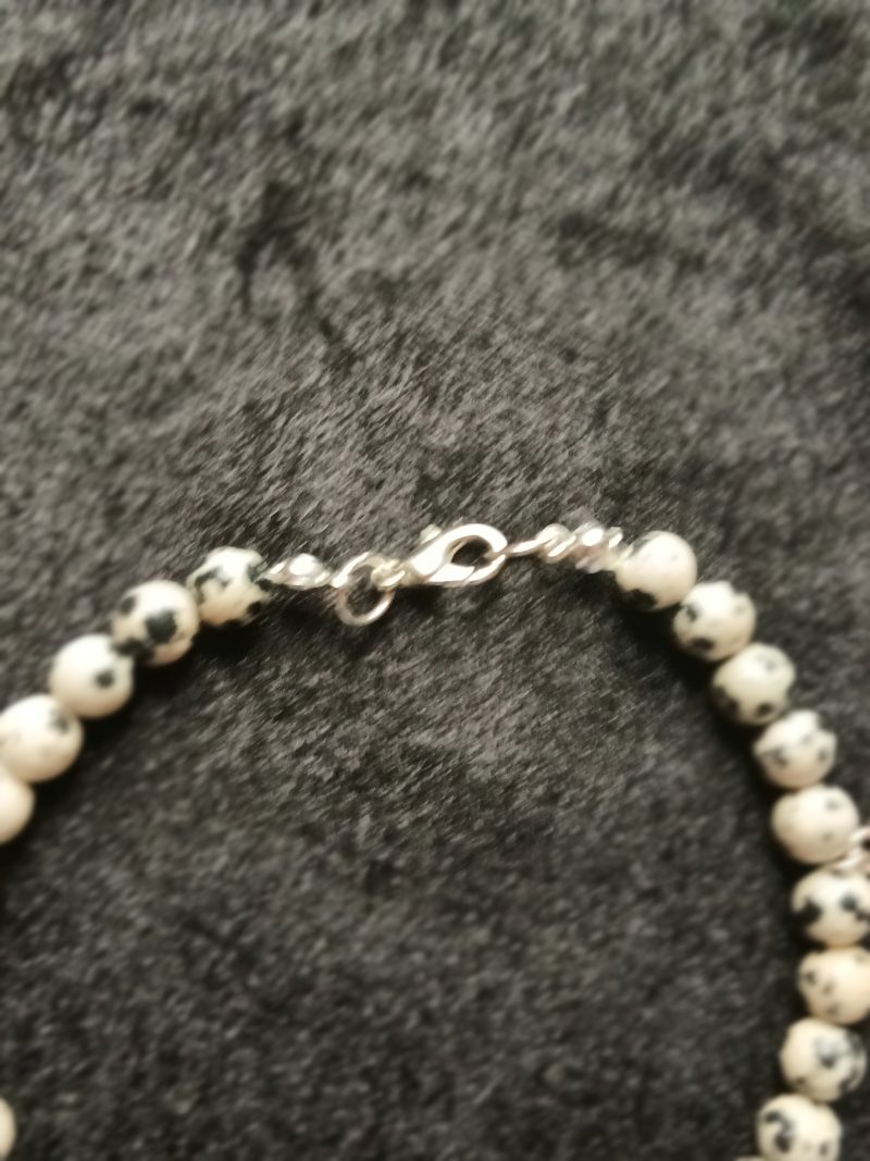 Hand-made bracelet made from natural gemstones with charms.