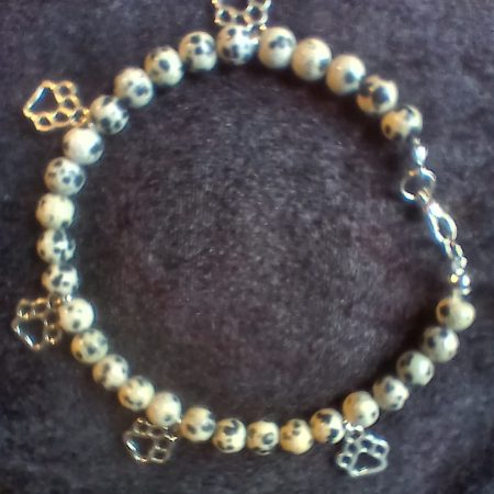 Hand-made bracelet made from natural gemstones with charms.