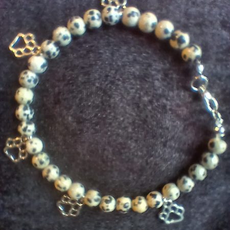 Hand-made bracelet made from natural gemstones with charms.