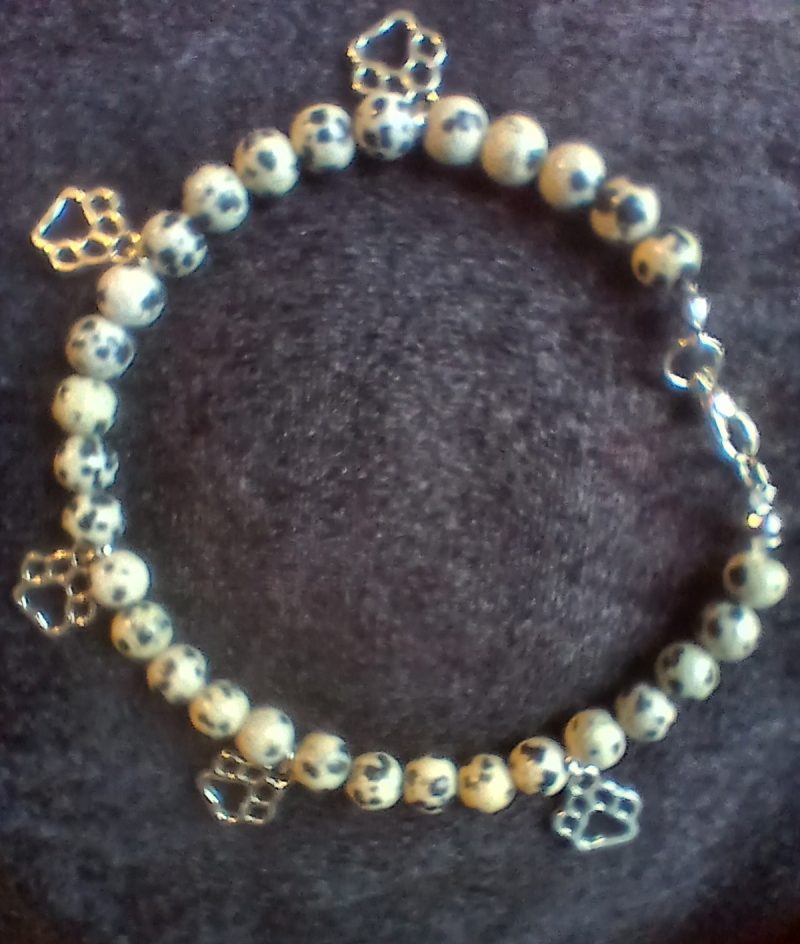 Hand-made bracelet made from natural gemstones with charms.