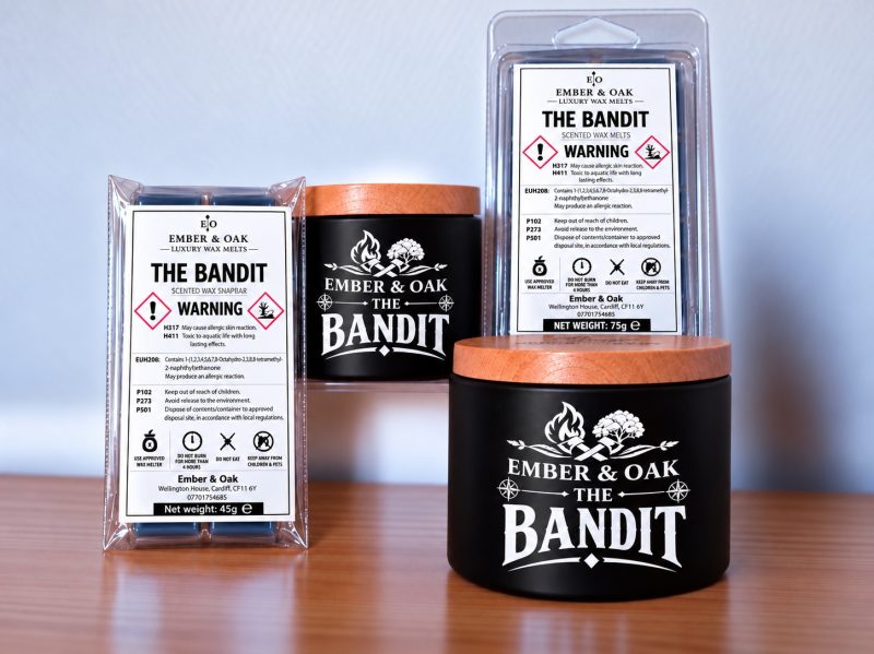 The Bandit candles, wax melts and snap bar packaging, showing product labels and safety warnings.