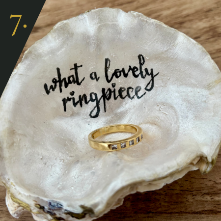 SHUCKED's oyster shell edition no.7, with message "what a lovely ring-piece"