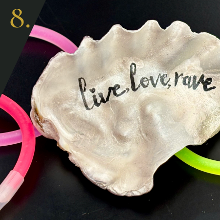 SHUCKED's oyster shell edition no.8, with message “live, love, rave”